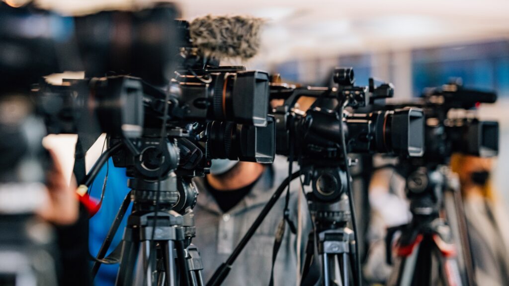 Cameras at a Live Media Conference.